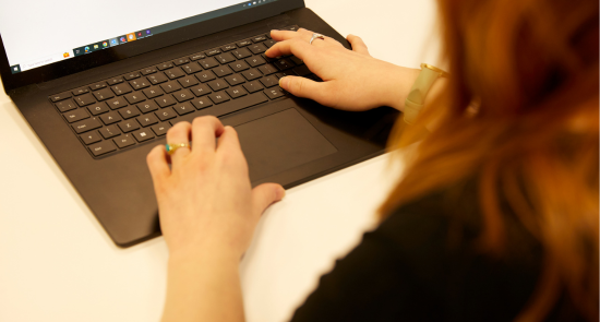 A person using a laptop)